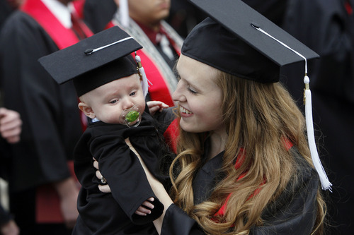 Francisco Kjolseth  |  The Salt Lake Tribune
Camille Larsen holds her son Charlie, 4 months, as they celebrate her degree at the University of Utah annual commencement ceremonies at the Huntsman Center in Salt Lake City on Friday, May 4, 2012.
