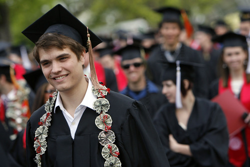 Francisco Kjolseth  |  The Salt Lake Tribune
Dan Minkevitch keeps a positive outlook decorated with money as he joins fellow University of Utah students for commencement ceremonies at the Huntsman Center in Salt Lake City on Friday, May 4, 2012.