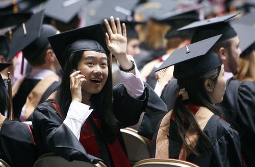 Francisco Kjolseth  |  The Salt Lake Tribune
Xin Liu, getting her master's of science in finance, waves to relatives as she attends the University of Utah's commencement ceremonies at the Huntsman Center in Salt Lake City on Friday, May 4, 2012.