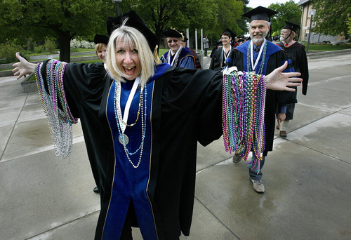 Scott Sommerdorf  |  The Salt Lake Tribune             
Professor Jeannie Thomas came equipped with Mardi Gras beads to hand out to graduates at Utah State University's Commencement, Saturday, May 5, 2012.