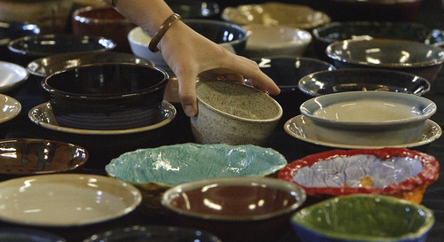 Leah Hogsten  |  The Salt Lake Tribune
Local artists from Clay Arts Utah handmade hundreds of  glazed pottery bowls to help feed the hungry via proceeds going to Catholic Community Services. at St. Vincent de Paul Resource Center, on Saturday in Salt Lake City