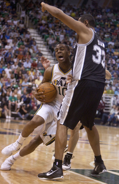 Jeremy Harmon  |  The Salt Lake Tribune

Alec Burks is fouled by Boris Diaw as the Jazz host the Spurs in the first round of the NBA playoffs at EnergySolutions Arena in Salt Lake City, Saturday, May 5, 2012.