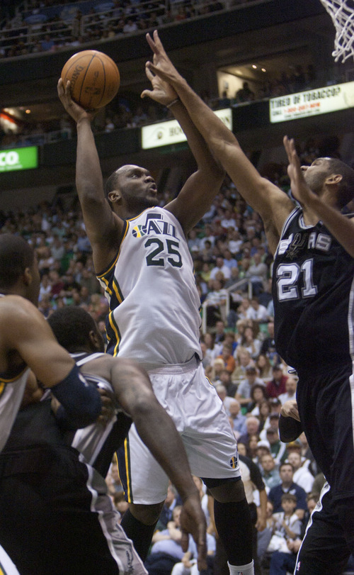 Jeremy Harmon  |  The Salt Lake Tribune

Al Jefferson shoots over Tim Duncan as the Jazz host the Spurs in the first round of the NBA playoffs at EnergySolutions Arena in Salt Lake City, Saturday, May 5, 2012.