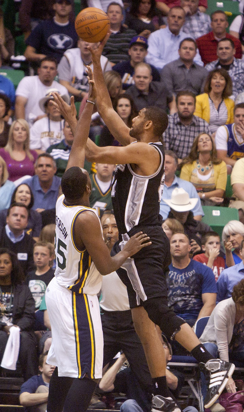 Jeremy Harmon  |  The Salt Lake Tribune

Tim Duncan shoots over Al Jefferson as the Jazz host the Spurs in the first round of the NBA playoffs at EnergySolutions Arena in Salt Lake City, Saturday, May 5, 2012.