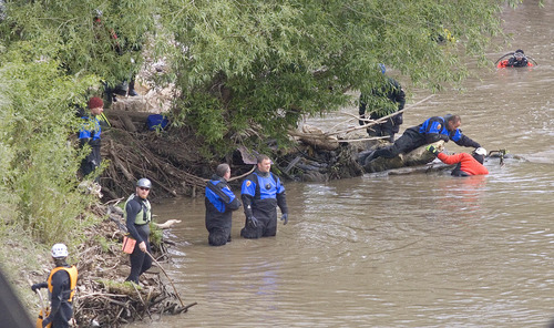 Paul Fraughton | Salt Lake Tribune
With the levels of the Weber River lowered volunteers search the river for the body of a 4-year-old Layton boy who fell into the swiftly moving waters eight days ago.
 Saturday, May 5, 2012
