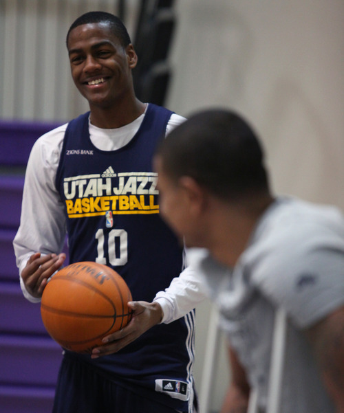 Lennie Mahler  |  The Salt Lake Tribune
Jazz players Alec Burks and Earl Watson chat before a practice at the Zions Bank Basketball Center on Sunday, May 6, 2012.