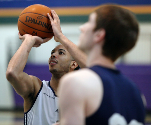 Lennie Mahler  |  The Salt Lake Tribune
Devin Harris shoots around with Gordon Hayward during a practice at the Zions Bank Basketball Center on Sunday, May 6, 2012.