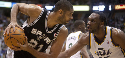 Jeremy Harmon  |  The Salt Lake Tribune

Tim Duncan is defended by Al Jefferson as the Jazz host the Spurs in the first round of the NBA playoffs at EnergySolutions Arena in Salt Lake City, Saturday, May 5, 2012.
