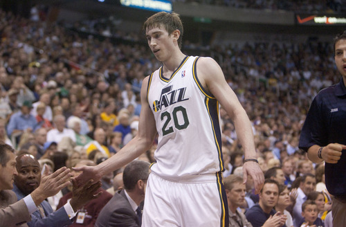 Jeremy Harmon  |  The Salt Lake Tribune

Gordon hayward gets high fives from the Jazz bench as the Jazz host the Spurs in the first round of the NBA playoffs at EnergySolutions Arena in Salt Lake City, Saturday, May 5, 2012.