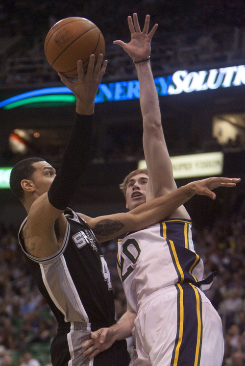 Jeremy Harmon  |  The Salt Lake Tribune

Gordon Hayward fouls Danny Green as the Jazz host the Spurs in the first round of the NBA playoffs at EnergySolutions Arena in Salt Lake City, Saturday, May 5, 2012.