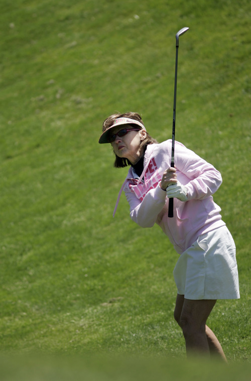 Kim Raff | The Salt Lake Tribune
Gail Winterfeld plays golf at Hidden Valley Country Club in Sandy on Sunday, May 6, 2012. Gail Winterfeld is the top fundraiser for the Utah chapter of the Susan G. Komen Foundation, which this year is seeing a drop in registrations for the May 12 Race for the Cure event held around the country due to the Planned Parenthood controversy. Gail, who had breast cancer, will walk the 5K course and plays golf to stay in shape.