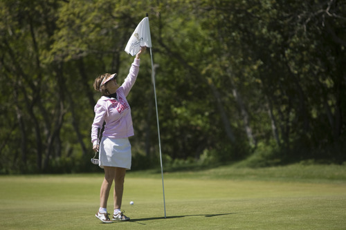 Kim Raff | The Salt Lake Tribune
Gail Winterfeld plays golf at Hidden Valley Country Club in Sandy on Sunday, May 6, 2012. Gail Winterfeld is the top fundraiser for the Utah chapter of the Susan G. Komen Foundation, which this year is seeing a drop in registrations for the May 12 Race for the Cure event held around the country due to the Planned Parenthood controversy. Gail, who had breast cancer, will walk the 5K course and plays golf to stay in shape.