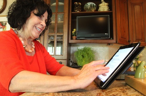 Rick Egan  | The Salt Lake Tribune 

Eva Heiner, 75, uses her iPad at her home in Salt Lake, Thursday, May 3, 2012. They are now offering classes at senior citizens centers and community centers for seniors on how to use these devices.