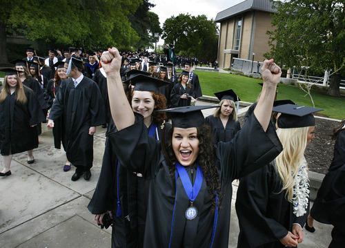 Scott Sommerdorf  |  The Salt Lake Tribune             
Utah State's Caine College of the Arts student Heidi Randall celebrates with classmates during the procession to USU's Commencement, Saturday, May 5, 2012.