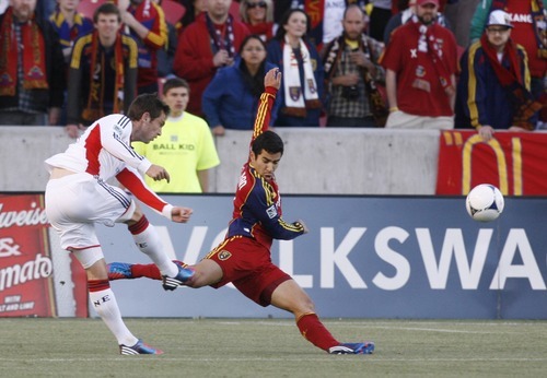 Rick Egan  | The Salt Lake Tribune 

New England's Blake Brettschneider scores a goal for the Revolution,  in MLS action, Real Salt Lake vs. New England Revolution, at Rio Tinto Stadium, Saturday, May 5, 2012.