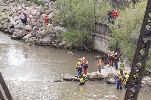 Paul Fraughton | Salt Lake Tribune
With the levels of the Weber River lowered, volunteers search Saturday, May 5, 2012, for the body of a 4-year-old Layton boy who fell into the swiftly moving waters more than a week earlier.