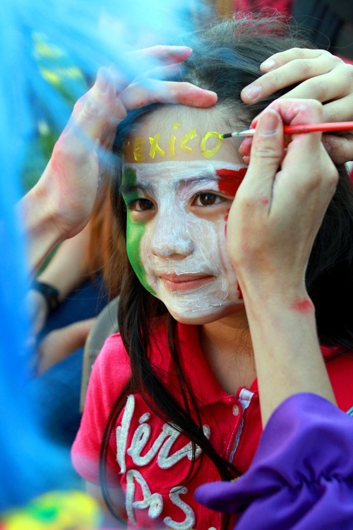 Stephen Holt | Special to the Tribune
Danelle Sepulveda, 7, celebrates Cinco de Mayo with a Mexican flag decoration at the annual Cinco De Mayo party at Centennial Park in West Valley City Saturday afternoon.