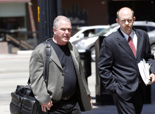Al Hartmann  |  The Salt Lake Tribune
Developer Terry Diehl, left,  enters U.S. Trustee Office hearing Tuesday May 8 in Salt Lake City.  He faced his creditors at a bankruptcy trustee hearing.