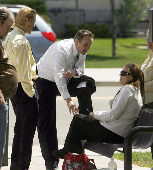 Francisco Kjolseth  |  The Salt Lake Tribune
Shannon Price, sitting, ex-wife of actor Gary Coleman, speaks with her attorney Todd Bradford, center left, outside of 4th District Court in Provo on Monday, May 7, 2012, for the start of a two-day hearing over the late Coleman's estate.