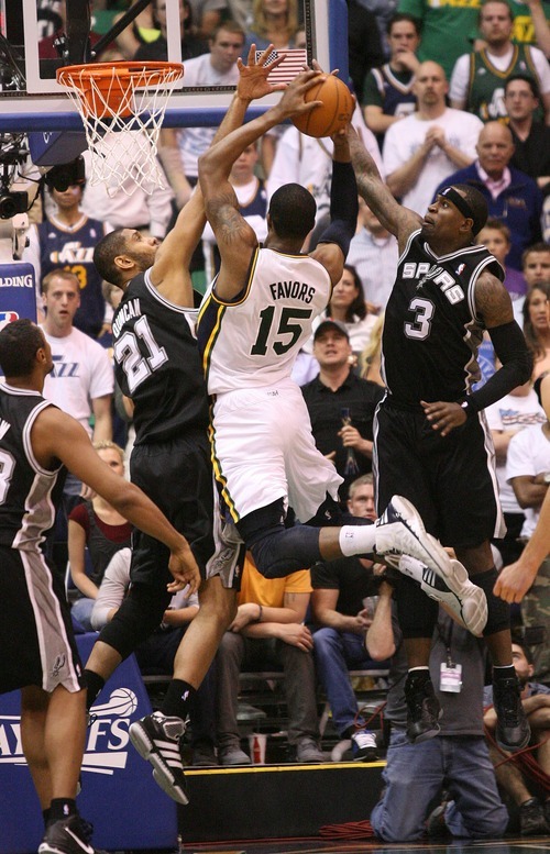 Paul Fraughton / Salt Lake Tribune
Utah's Derrick Favors flies  to the basket  drawing the foul as San Antonio's Tim Duncan and Stephen Jackson defend.The Utah Jazz played the San Antonio Spurs in game 4 of the  first round of the playoffs at Energy Solutions Arena.
 Monday, May 7, 2012