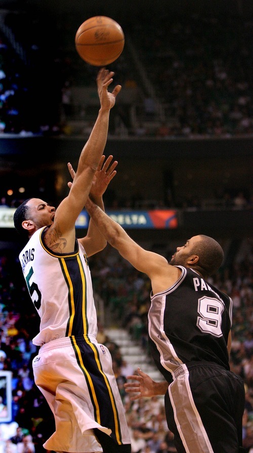 Paul Fraughton / Salt Lake Tribune
Tony Parker puts a hand in the face of Devin Harris as he goes up for the shot. The Utah Jazz played the San Antonio Spurs in game 4 of the  first round of the playoffs at Energy Solutions Arena.
 Monday, May 7, 2012