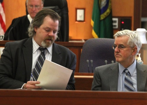 Rick Egan  | The Salt Lake Tribune 

Defense attorney Travis Currie (left) talks to Steve Powell, in the Pierce County Superior Court, in Tacoma, Washington,  Monday, May 7, 2012.   Powell is the father-in-law of missing West Valley City woman Susan Powell. Judge Ronald E. Culpepper is presiding over the estimated eight-day trial on voyeurism and pornography charges.