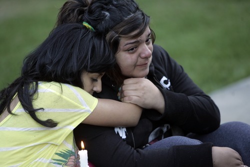 Kim Raff | The Salt Lake Tribune
(right) Karyna Martinez and (left) Selina Medina embrace during a vigil for Jacob Armijo and Avery Bock, who died in a car accident earlier in the day at Hunter High School in West Valley City, Utah on May 9, 2012.