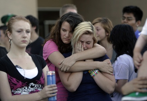 Kim Raff | The Salt Lake Tribune
(middle left) Michaela Lewis hugs (middle right) Cheryl Rasmussen during a vigil for Jacob Armijo and Avery Bock, who died in a car accident earlier in the day at Hunter High School in West Valley City, Utah on May 9, 2012.