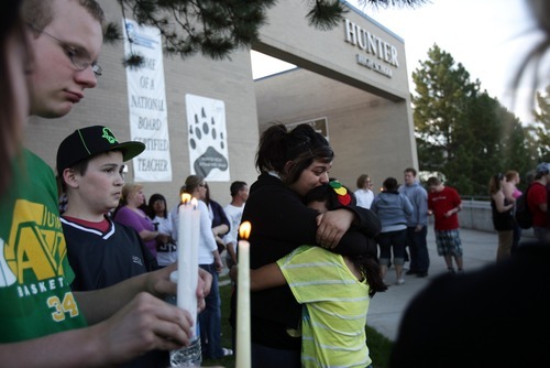 Kim Raff | The Salt Lake Tribune
(center left) Karyna Martinez and (center right) Selina Medina embrace during a vigil for Jacob Armijo and Avery Bock, who died in a car accident earlier in the day at Hunter High School in West Valley City, Utah on May 9, 2012.