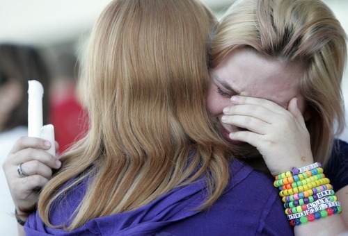 Kim Raff | The Salt Lake Tribune
 Cheryl Rasmussen is comforted during a vigil for Jacob Armijo and Avery Bock, who died in a car accident earlier in the day at Hunter High School in West Valley City, Utah on May 9, 2012.