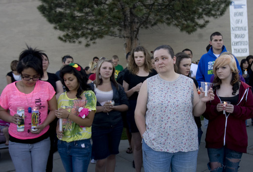 Kim Raff | The Salt Lake Tribune
Family and friends of Jacob Armijo and Avery Bock, who died in a car accident earlier in the day, gather at a vigil at Hunter High School in West Valley City, Utah on May 9, 2012.