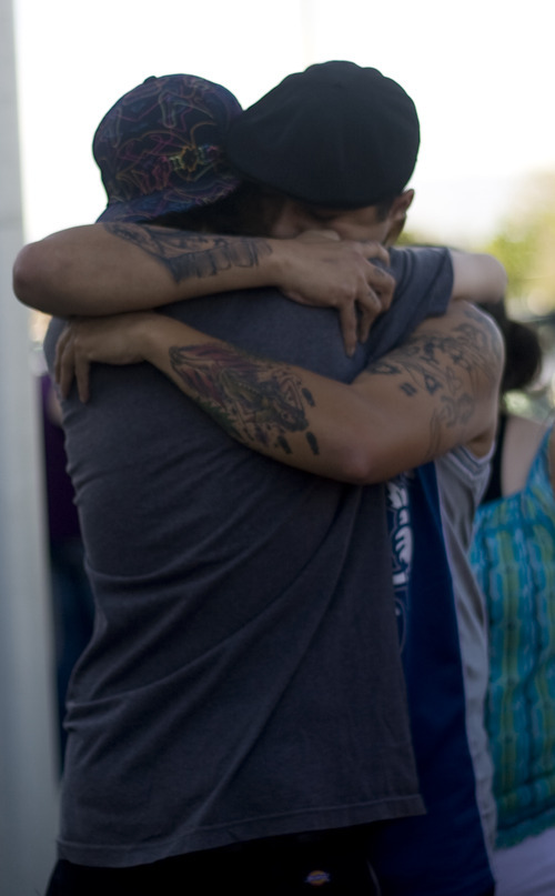 Kim Raff | The Salt Lake Tribune
(back) Dom Montoya and Kelli Etcheverry embrace during a vigil for Jacob Armijo and Avery Bock, who died in a car accident earlier in the day at Hunter High School in West Valley City, Utah on May 9, 2012.