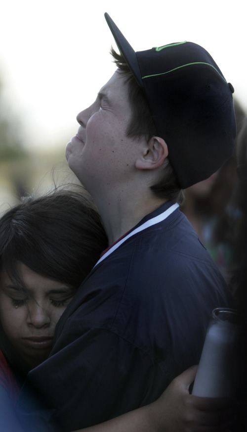 Kim Raff | The Salt Lake Tribune
(top) Triston Harms and (bottom) Peace Pulido comfort each other during a vigil for Jacob Armijo and Avery Bock, who died in a car accident earlier in the day, at Hunter High School in West Valley City, Utah on May 9, 2012.