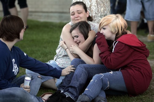 Kim Raff | The Salt Lake Tribune
(middle) Kasena Marshall is comforted by (left) Jessica Leishman and (right) Ashley Leishman during a vigil for Jacob Armijo and Avery Bock, who died in a car accident earlier in the day at Hunter High School in West Valley City, Utah on May 9, 2012.