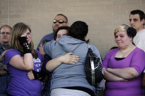 Kim Raff | The Salt Lake Tribune
(middle back) Shyanne Bock, sister of Avery Bock, is comforted during a vigil for Jacob Armijo and Avery Bock, two teens who died in a car accident earlier in the day, at Hunter High School in West Valley City, Utah on May 9, 2012.
