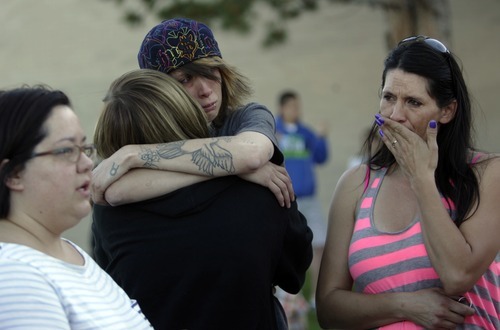Kim Raff | The Salt Lake Tribune
(center) Kelli Etcheverry, niece of Jacob Armijo,  and (right) Toni Snarr, sister of Jacob Armijo, become emotional during a vigil for Jacob Armijo and Avery Bock, two teens who died in a car accident earlier in the day, at Hunter High School in West Valley City, Utah on May 9, 2012.