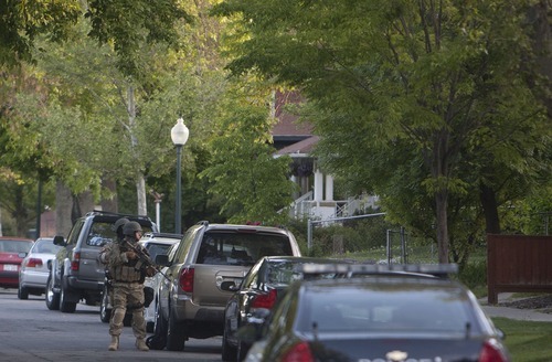 Jeremy Harmon  |  The Salt Lake Tribune

Salt Lake City SWAT team members stand outside a home at 1225 S. Windsor during a standoff with a man who had taken a woman hostage Thursday, May 10, 2012.