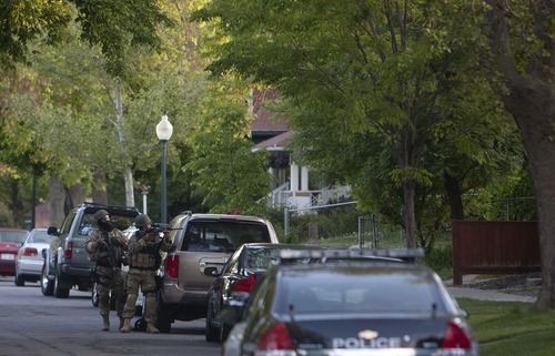 Jeremy Harmon  |  The Salt Lake Tribune

Salt Lake City SWAT team members stand outside a home at 1225 S. Windsor during a standoff with a man who had taken a woman hostage Thursday, May 10, 2012.