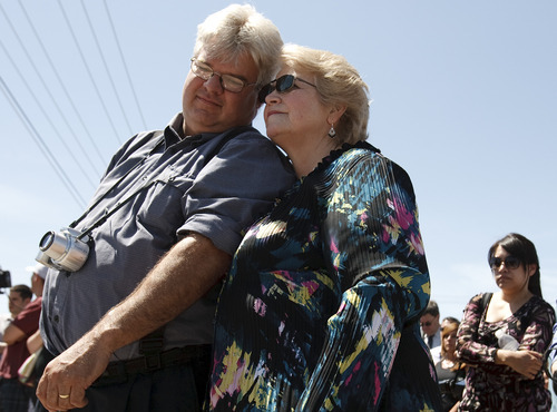 Leah Hogsten  |  The Salt Lake Tribune
Doug White and his wife Janine shed tears of joy at the  groundbreaking on the Sugar House streetcar project  Wednesday, May 9, 2012, in Salt Lake City. White, a train enthusiast, saw the day as a culmination of a dream come true after working to get the Sugarhouse streetcar line dedicated for the 11 years.  The two-mile route will run from the 2100 South TRAX Station to the Sugarhouse commercial district near Highland Drive and 2235 South.