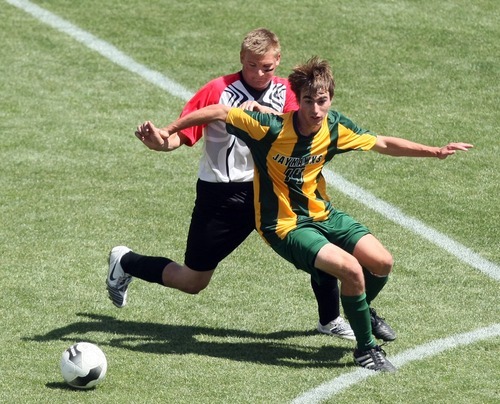 Chris Detrick  |  The Salt Lake Tribune
Manti's Dan Lund (18) and St. Joseph's Connor Letender (14) go for the ball during the 2A soccer championship game at Rio Tinto Stadium Saturday May 12, 2012. Manti won the game 3-2.