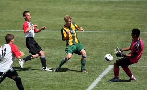 Chris Detrick  |  The Salt Lake Tribune
Manti's Antonio Jimenez (13) makes a save on a shot attempt by St. Joseph's Adam Brodstein (8) go for the ball during the 2A soccer championship game at Rio Tinto Stadium Saturday May 12, 2012. Manti won the game 3-2.