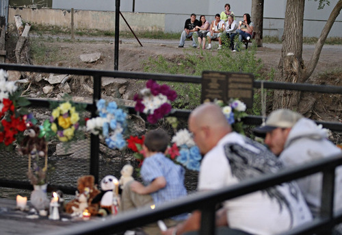 Lennie Mahler  |  The Salt Lake Tribune
People gather for a vigil for Corbin Anderson on Sunday, May 13, 2012, near where he fell into the Weber River April 28. Corbin's body was found downriver about a quarter mile from where he fell.