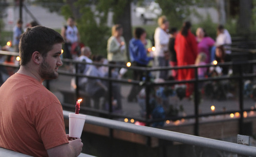 Lennie Mahler  |  The Salt Lake Tribune
Darin Stansfield holds a candle during a vigil for Corbin Anderson, who fell into the Weber River on April 28. Corbin's body was found downriver about a quarter mile from where he fell. Sunday, May 13, 2012.