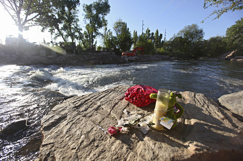 Lennie Mahler  |  The Salt Lake Tribune
A memorial lies on a rock Sunday, May 13, 2012, where Corbin Anderson fell into the Weber River on April 28. Corbin's body was found downriver about a quarter mile from where he fell.