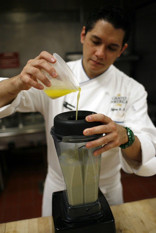 Francisco Kjolseth  |  The Salt Lake Tribune
Jeffrey de Leon, executive pastry chef at the Grand America Hotel in Salt Lake City, demonstrates how to make a crepe. Step No. 2: With the machine running, slowly pour in the warm melted butter, in a slow-steady stream. Blend until the butter is completely emulsified. Cover and refrigerate at least 2 hours, but preferably overnight.