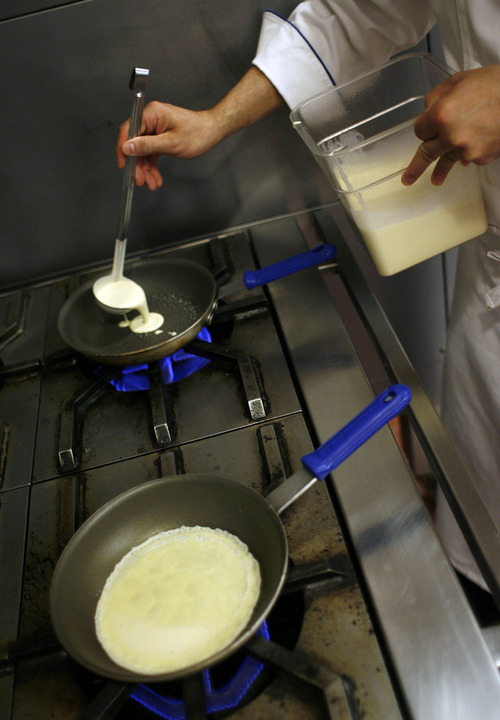 Francisco Kjolseth  |  The Salt Lake Tribune
Jeffrey de Leon, executive pastry chef at the Grand America Hotel in Salt Lake City, demonstrates how to make a crepe. Step No. 3: Ladle  batter into a heated pan. Tilt the pan to cover the bottom. Cook for about 1 minute then flip and cook another 15 to 30 seconds.