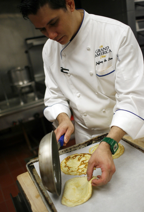 Francisco Kjolseth  |  The Salt Lake Tribune
Jeffrey de Leon, executive pastry chef at the Grand America Hotel in Salt Lake City, demonstrates how to make a crepe. 
Step No. 4: Remove crepes from pan and place on parchment paper. Cover and place in the oven to stay warm until ready to serve.
