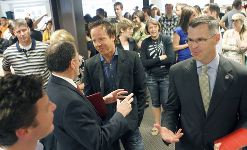 Al Hartmann  |  The Salt Lake Tribune
Utah Gov. Gary Herbert, left, greets Qualtrics CEO Ryan Smith at an event Tuesday marking the company's announcement that it has closed on a $70 million round of investment funding.