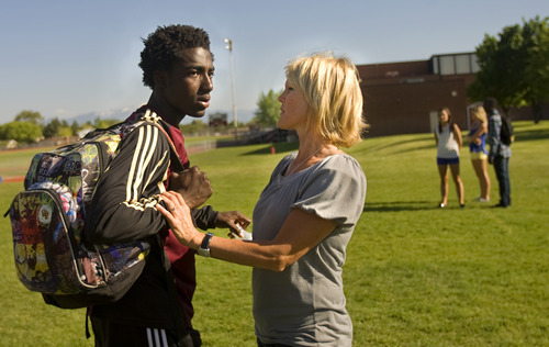 Kim Raff | The Salt Lake Tribune
Shelley Johnson and her adopted son Kofi Johnson after a game against American Fork High School in American Fork on May 9, 2012.  Kofi Johnson is a Ghanan orphan who was adopted by the family of former NFL kicker/punter Lee Johnson. The 18-year-old Lone Peak soccer player has struggled to adapt to American customs and the spirit of family, but thanks to the efforts of his new mother, Shelley, they are coming together and creating an unexpected recipe for hope.