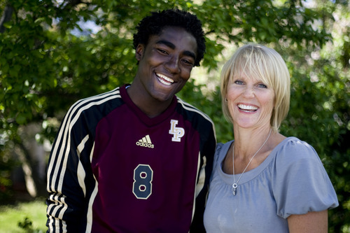 Kim Raff | The Salt Lake Tribune
Shelley Johnson and her adopted son Kofi Johnson after a game against American Fork High School in American Fork on May 9, 2012.  Kofi Johnson is a Ghanan orphan who was adopted by the family of former NFL kicker/punter Lee Johnson. The 18-year-old Lone Peak soccer player has struggled to adapt to American customs and the spirit of family, but thanks to the efforts of his new mother, Shelley, they are coming together and creating an unexpected recipe for hope.